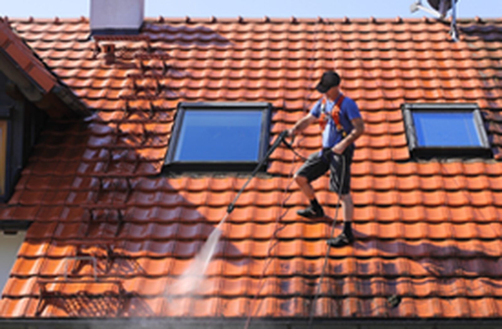 Soft-wash roof cleaning